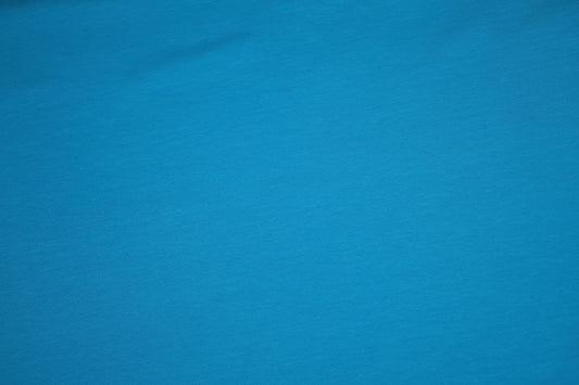 Türkisblau Baumwolljersey - Detailbild der elastischen Stoffqualität