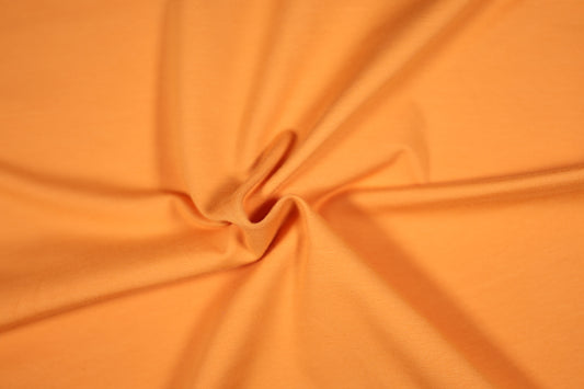 Elastischer Baumwolljersey in Hellorange – hochwertiger Stoff für DIY-Projekte