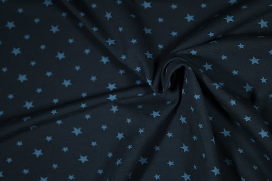 Kinderstoff mit Sternen auf dunkelblauem Grund – ideal für Deko & Kleidung.