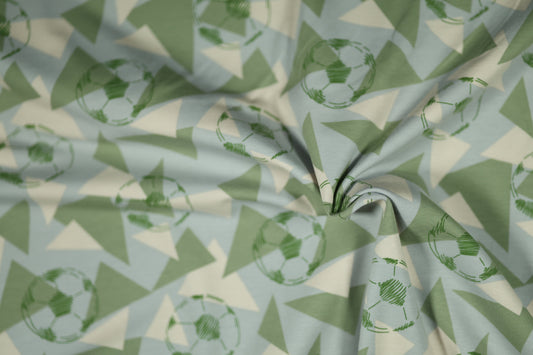 Baumwollstoff mit Motiv: fußballmuster auf blau-grün – weich & kindgerecht.