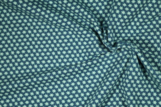 Baumwollstoff mit Motiv: kleine blüten auf marineblau – weich & kindgerecht.