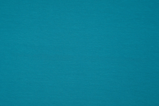 Türkisblauer Jersey Stoff gefaltet – weicher elastischer Bekleidungsstoff