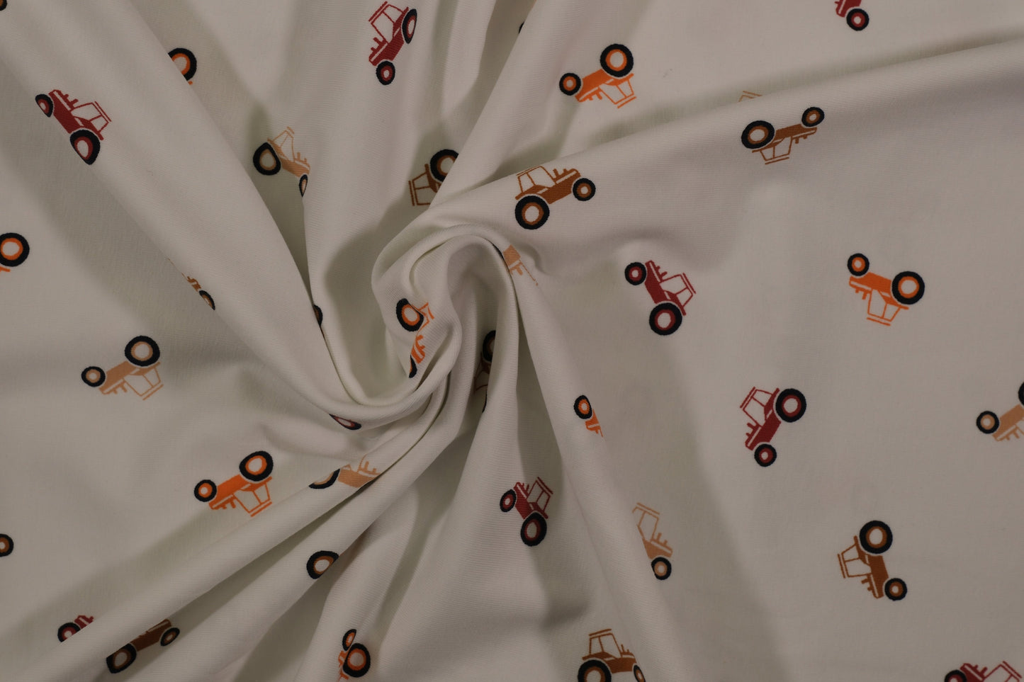 Ecrufarbener Baumwolljersey mit kleinen Traktoren