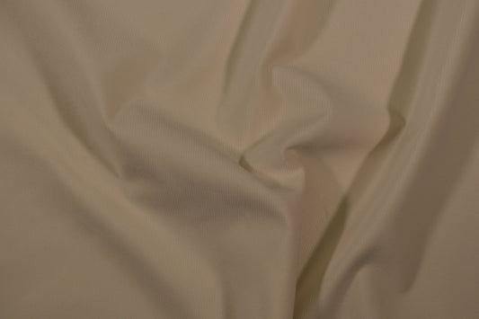 Möbelstoff in Uni-Creme mit glatter, feiner Struktur Detailaufnahme der Stoffstruktur