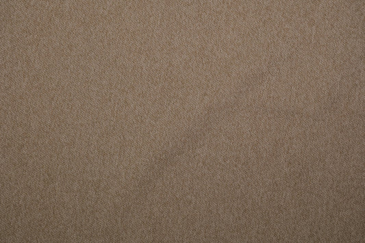 Möbelstoff Bouclé in Sandbeige als Polsterstoff für Sofa und Sessel Detailaufnahme der Stoffstruktur