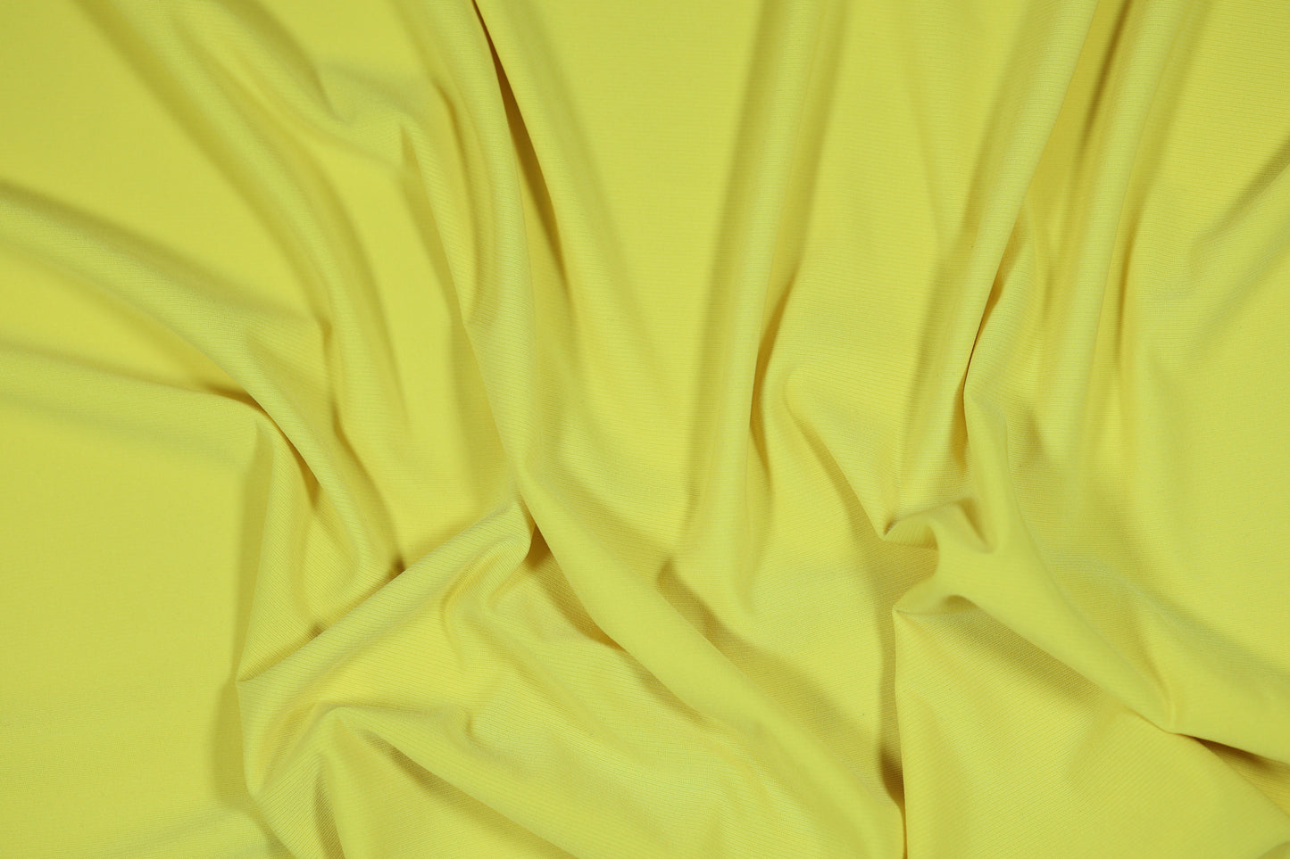 Elastischer Jersey in einem hellen, sonnigen Gelbton für Sommerbekleidung