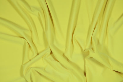 Elastischer Jersey in einem hellen, sonnigen Gelbton für Sommerbekleidung