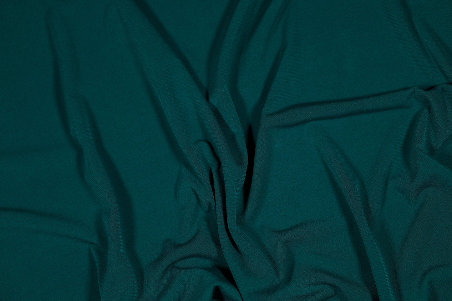 Eleganter Jerseystoff in tiefem Smaragdgrün, weich drapiert