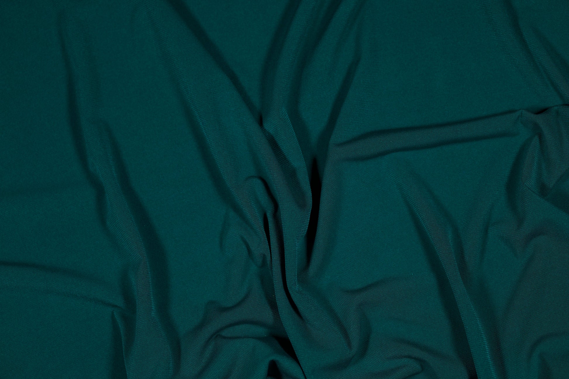 Eleganter Jerseystoff in tiefem Smaragdgrün, weich drapiert